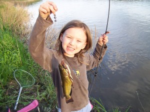 Abby with a yellow bullhead (Souris River, Manitoba, Canada)