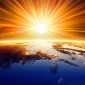 23744027 - abstract religious backgrounf - bright sun shines above planet earth