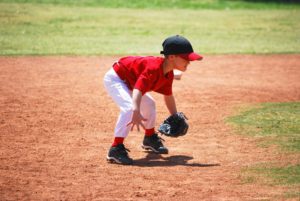 18843483 - little league short stop in ready position.